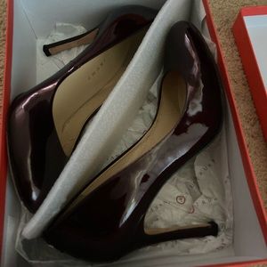 Size 10 dark red patent leather Ivanka Trump 3 inch heels. In good condition.